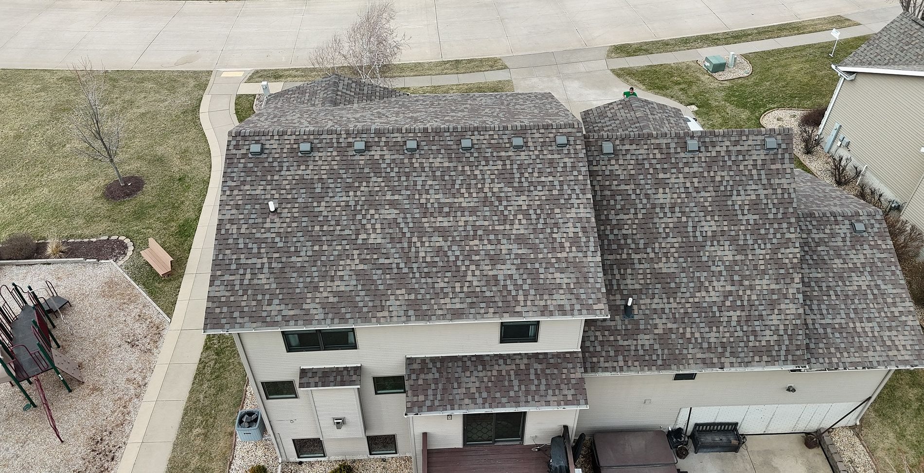 The same Bettendorf, Iowa roof after Mitten installed CertainTeed Landmark Pro shingles in Prairie Wood, rear view