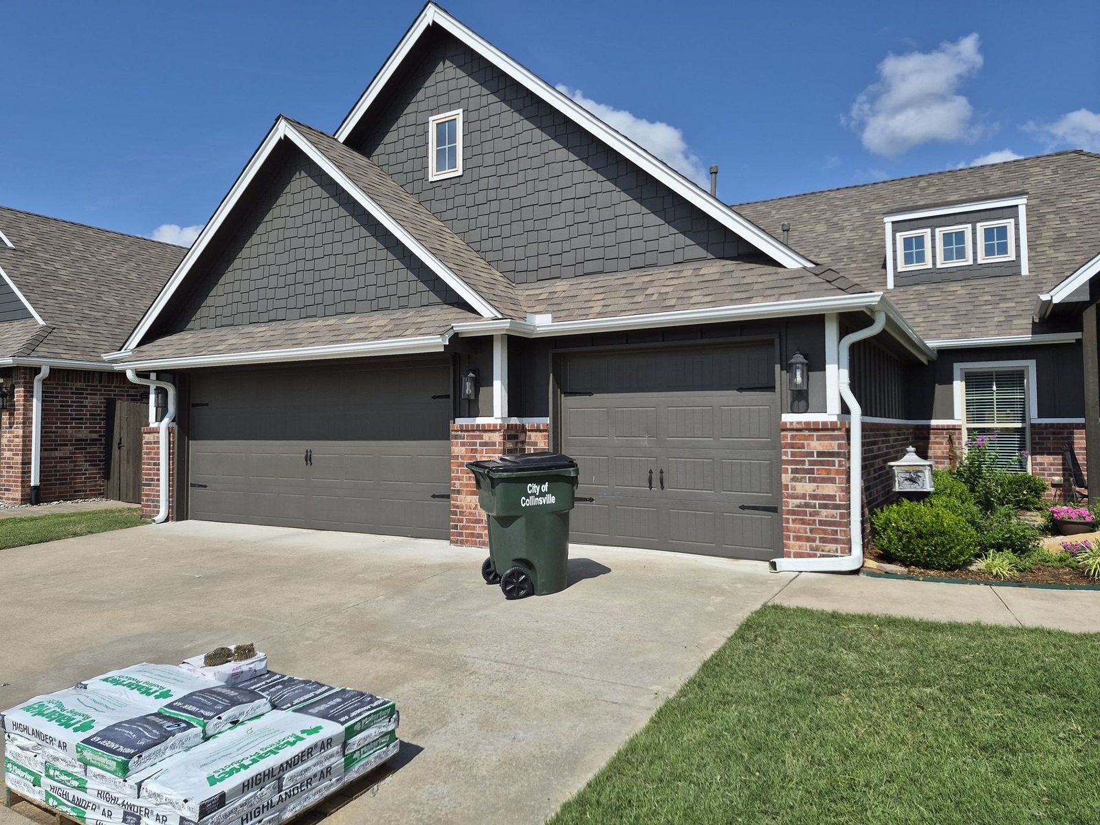 Pallet of Malarkey Highlander AR shingles delivered to a Collinsville, Oklahoma home for a Mitten roof replacement