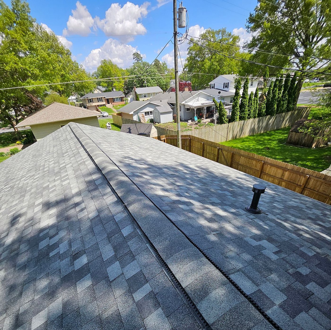 New IKO Dynasty shingles in Castle Gray with ridge vent on a home in Eldridge, Iowa, installed by Mitten