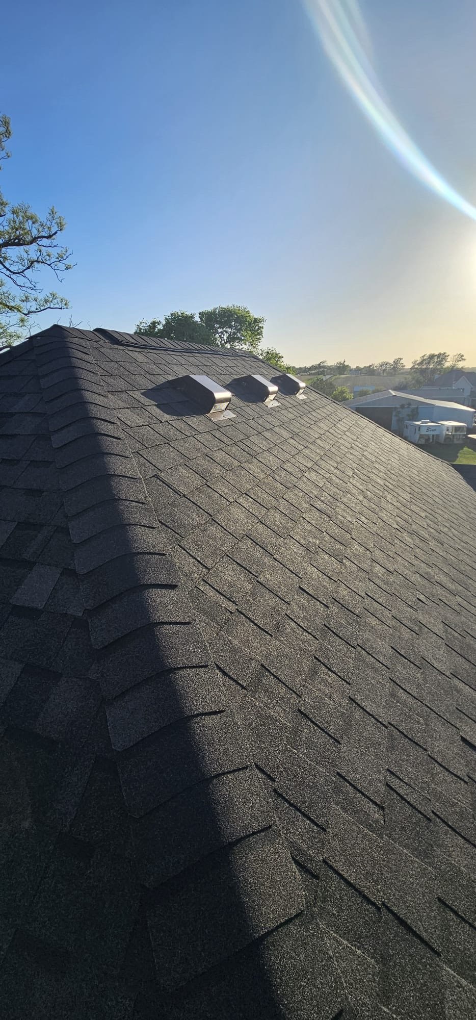 Finished shingles, ridge caps and roof vents in Long Grove, Iowa